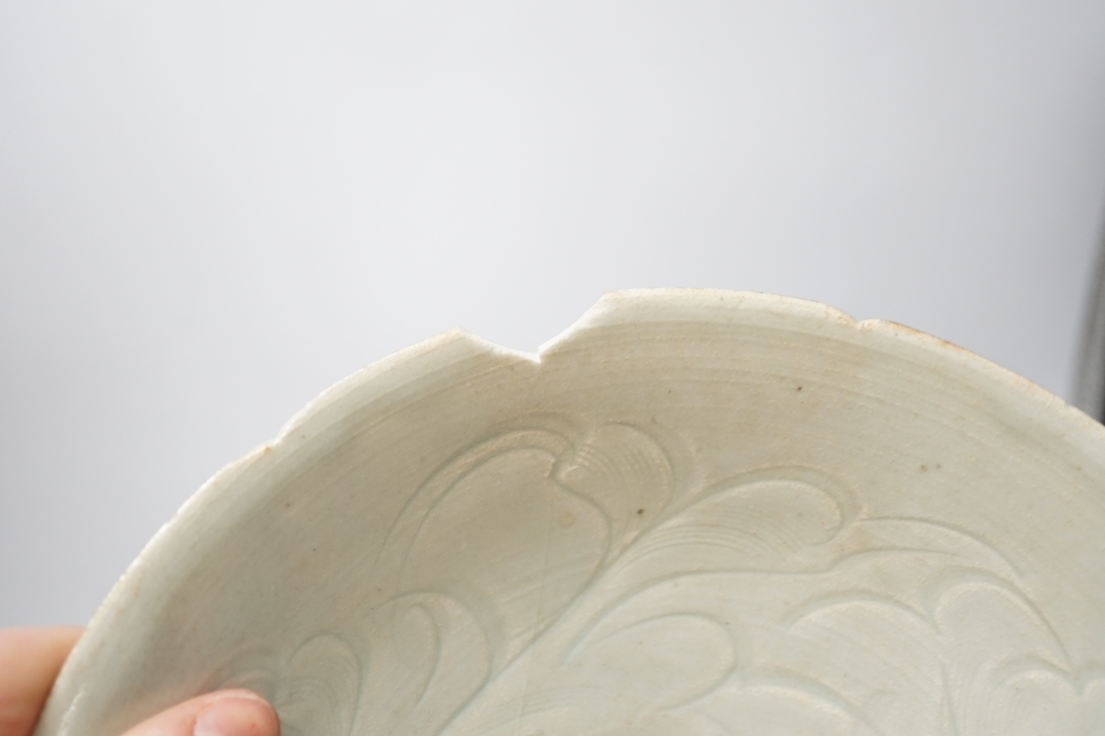 A Chinese incised Qingbai bowl, Song Dynasty and two green glazed Ming Dynasty pottery models of vessels, bowl 20cm diameter